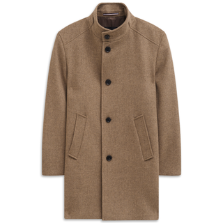 Brown coat with black buttons on a white background