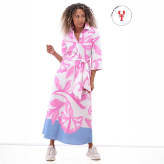 Woman wearing a pink and white floral robe with a blue bottom section on a white background.