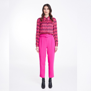 A model wearing the Badoo Hot Pink Belted Trouser in Hot Pink. 