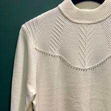 Load image into Gallery viewer, Upclose of pearl detail on cream jumper 
