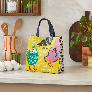 Colorful tote bag with chicken design on a kitchen counter