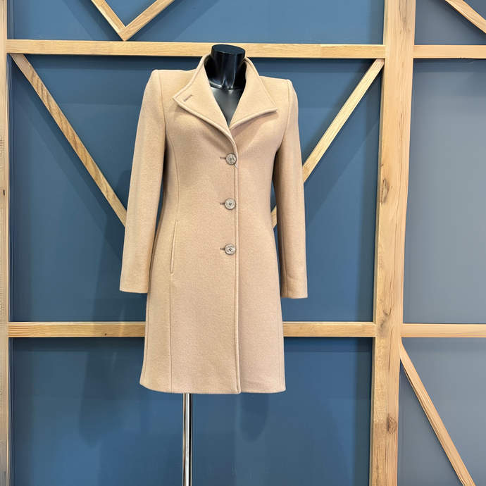 Tan Coat on Mannequin on Geometric Background