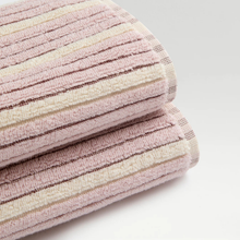 Load image into Gallery viewer, Stack of pink and beige striped towels on a light gray background
