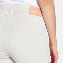 Load image into Gallery viewer, female model closeup wearing angel jeans in stone colour
