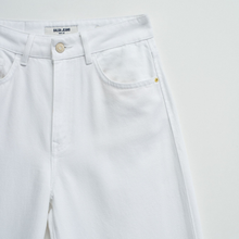 Load image into Gallery viewer, White jeans with a brand label on a light gray background
