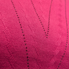 Load image into Gallery viewer, Close-up of a pink fabric with black bead detailing
