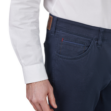 Load image into Gallery viewer, Navy blue jeans with a white shirt on a white background
