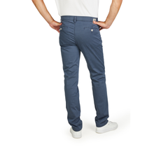 Load image into Gallery viewer, Blue pants worn by a person on a white background

