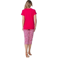 Load image into Gallery viewer, Woman wearing a pink t-shirt and patterned capri pants on a white background
