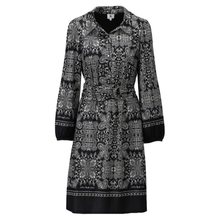 Load image into Gallery viewer, A long-sleeve collared wrap-style dress with a black and white intricate paisley and floral pattern, featuring a matching waist tie and decorative borders on the cuffs and hem.

