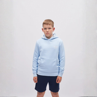 Child wearing a light blue hoodie and navy shorts on a white background