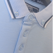 Load image into Gallery viewer, Close up view of the collar on the  Diesel Nixon Boys Polo Shirt, in Sky colour, with a white background.
