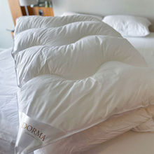 Load image into Gallery viewer, White pillows on a bed with a visible Dorma label.
