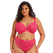 Load image into Gallery viewer, A plus-size model wearing a bright pink lace bra and matching high-waisted briefs against a plain white background.
