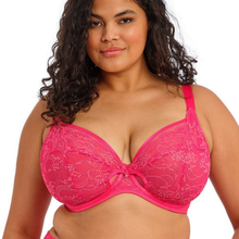 Load image into Gallery viewer, A plus-size woman wearing a bright pink floral lace bra with a center bow, shown against a plain white background.
