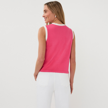 Load image into Gallery viewer, Woman wearing a pink sleeveless top and white pants on a plain background

