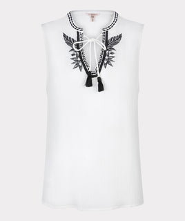 esqualo top in off white colour with embroidered design on the front