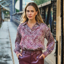 Load image into Gallery viewer, Model wearing print blouse with pleather trousers 
