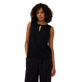 Image of mid view of model, wearing the Esqualo Bow Brooch Blouse.