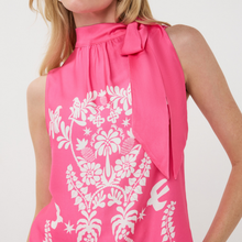 Load image into Gallery viewer, Pink top with white floral pattern and bow detail on a plain background
