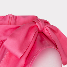 Load image into Gallery viewer, Close-up of a pink top with a bow detail on a white background
