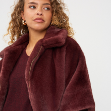 Load image into Gallery viewer, Poncho on model on pale background - Close up 
