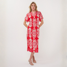 Load image into Gallery viewer, Woman wearing a red dress with white floral patterns on a white background
