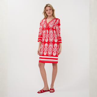 Woman in dress on pale background 