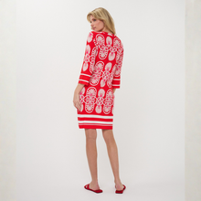 Load image into Gallery viewer, Woman in dress on pale background 
