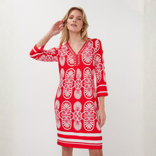 Load image into Gallery viewer, Woman in dress on pale background 
