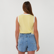 Load image into Gallery viewer, Person wearing a yellow sleeveless top and blue denim shorts on a white background
