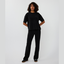 Load image into Gallery viewer, Person wearing a black outfit on a white background
