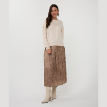 Load image into Gallery viewer, Woman wearing a cream sweater and patterned skirt on a white background
