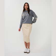 Load image into Gallery viewer, Woman wearing a gray sweater with floral design and beige skirt on a white background
