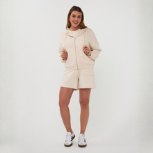 Load image into Gallery viewer, Woman in zip top and matching shorts 
