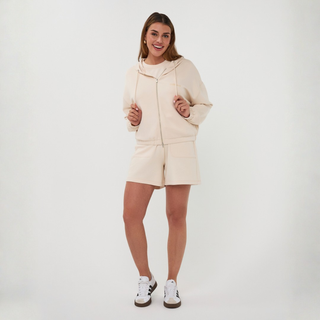 Woman in zip top and matching shorts 