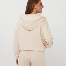 Load image into Gallery viewer, Woman in zip top and matching shorts 
