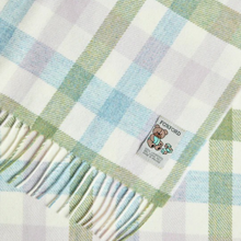 Load image into Gallery viewer, Plaid blanket with a visible Foxford label featuring a teddy bear design.
