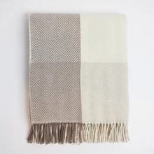 Load image into Gallery viewer, Woven blanket with herringbone pattern and fringes on a white background
