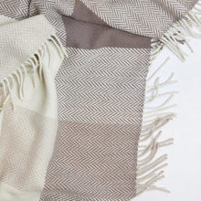 Load image into Gallery viewer, Textured blanket with herringbone pattern and fringes on a white background
