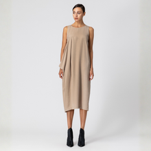 Load image into Gallery viewer, Woman wearing a beige sleeveless dress on a white background
