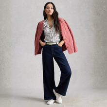 Load image into Gallery viewer, Model posing wearing White Stuff Ann SS Jersey Shirt, with a light grey background.
