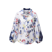 Load image into Gallery viewer, Floral patterned shirt on a white background
