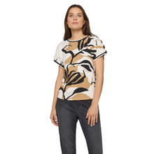 Load image into Gallery viewer, Woman wearing a patterned shirt and jeans on a white background
