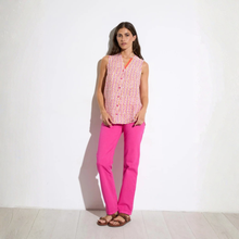 Load image into Gallery viewer, Full front view of model wearing Tinta Sleeveless Shirt in coral pink, with a white background.
