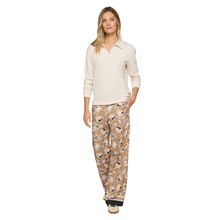 Load image into Gallery viewer, Woman wearing a cream long-sleeve top and patterned pajama pants on a white background
