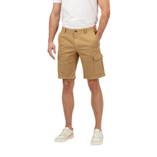 Load image into Gallery viewer, Lower half of body man in cargo shorts with hand in pocket and trainer 
