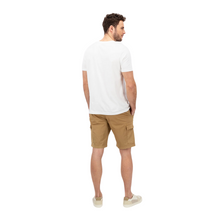 Load image into Gallery viewer, Rear view of model with T-shirt and Shorts, hands in pockets and trainers 
