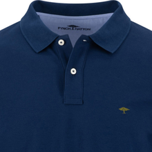 Load image into Gallery viewer, Close-up of a navy blue polo shirt with a two-button placket, featuring a small embroidered tree logo on the left chest and the brand name 'FYNCHILLATTON' printed inside the collar.
