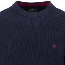 Load image into Gallery viewer, A close-up of a navy blue ribbed knit sweater with a small red embroidered Falcon logo on the chest and a dark red inner collar lining.
